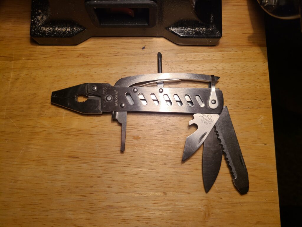 Modified this multitool to have a more useful phillips driver, no spring, and be easier to disassemble in the future. Wish there were more mutitools with this "form factor" so I could just buy one that has the right features.