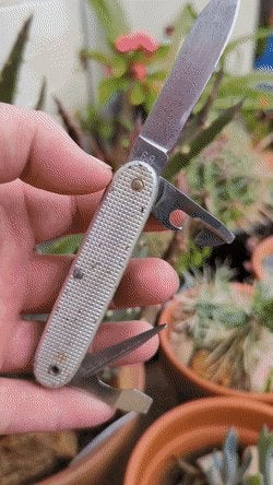A vintage 1968 Swiss Army `Soldier` silver Alox knife made by the Victorinox company