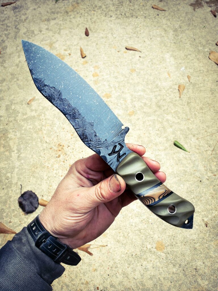 80crv2 with OD green G10 and a tan and a black layered split with titanium pins 🤙