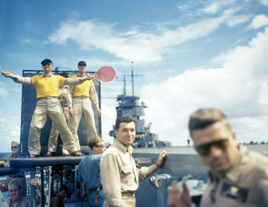A few weeks ago this image was posted in a thread here. I was hoping someone could explain why there's a young lad on the end of a rope. Bottom of the picture towards the left.