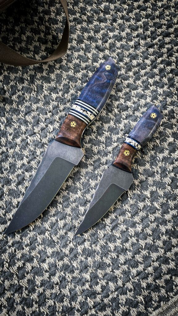 Matching pair of blades I got to handle. They are made by AUX MFG. One of them glows...