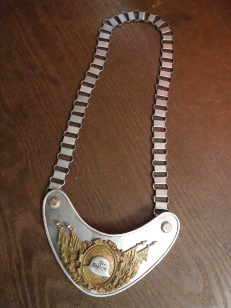 3 of 3- Not a knife, but goes with the 2 previous WW2 German artifacts. German WW2 Gorget, aluminum plate with 2 piece insignia of aluminum "Der Stahlhelm" (Steel Helmets) on a gilt aluminum insignia, steel chain, marked RZM and maker marked M34/2 on back on clip, felt back [4608x3456][OS][OC]
