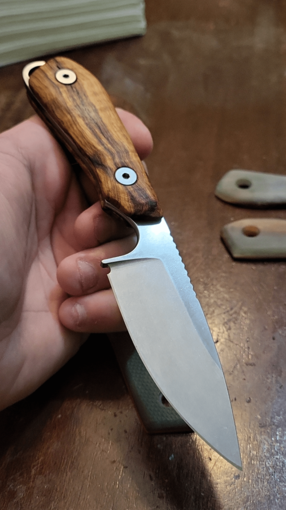 Made some custom knife scales for my White River M1 from thousand year old olive wood