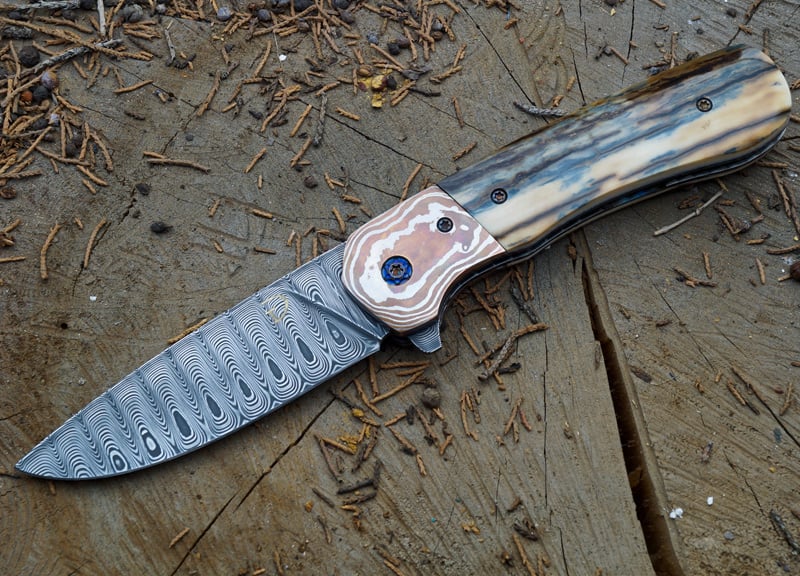 Custom from DT Knives. Mammoth Ivory with Damasteel blade and Mokume bolsters