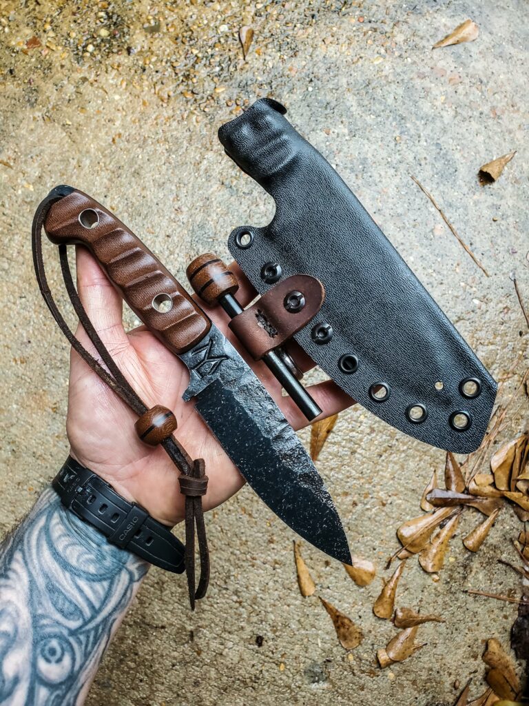80crv2 with some G10 and Dark Micarta, Titanium pins.