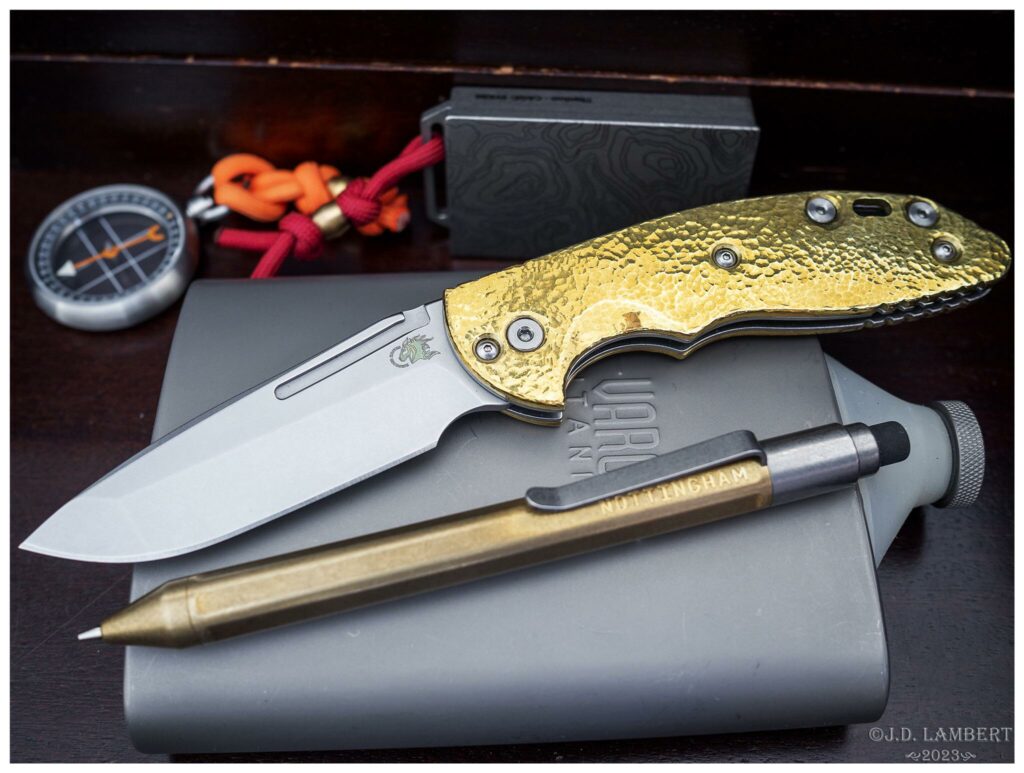 Brass & Titanium: Hinderer XM Slippy (Custom Brass Scales), Nottingham Tactical LeadSlinger Pencil, Vargo Titanium Flask, CountyComm Heirloom Compass & Titanium Strongbox [OC]