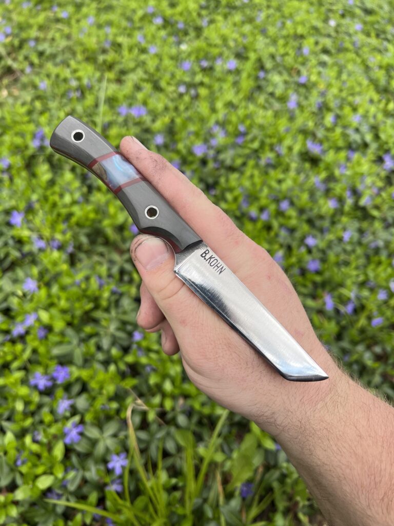 I’m very proud of this handle. It’s Black Pearl carbon fiber, wood&epoxy inlay, and maroon G10 liners on a A2 tanto with stainless tubes. Love to hear what you think!