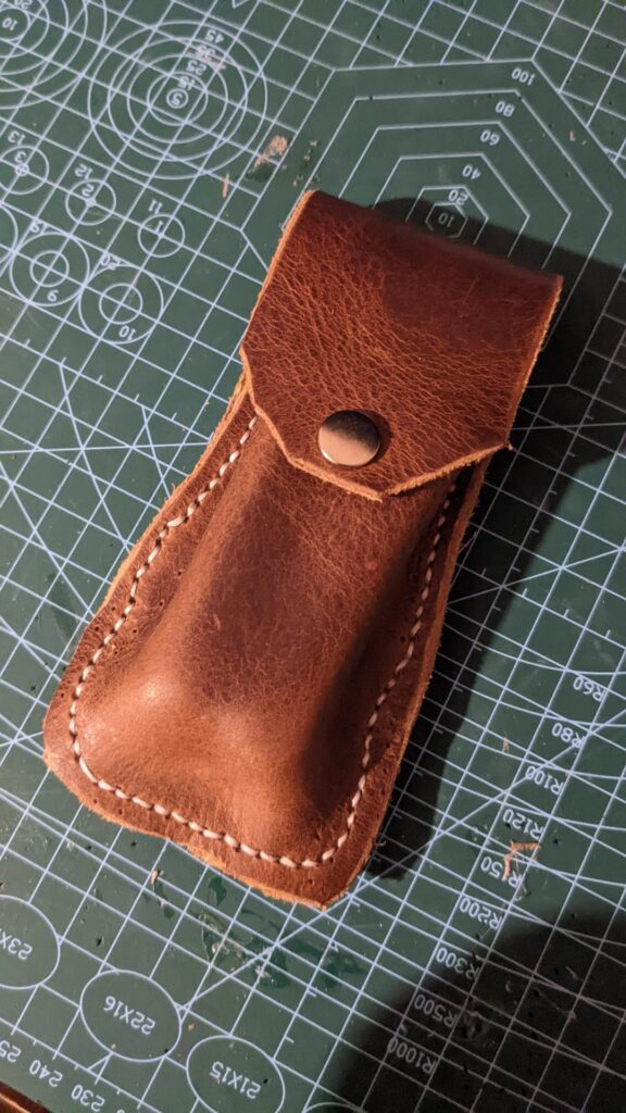 my brothers off brand Leatherman + pouch i made for it