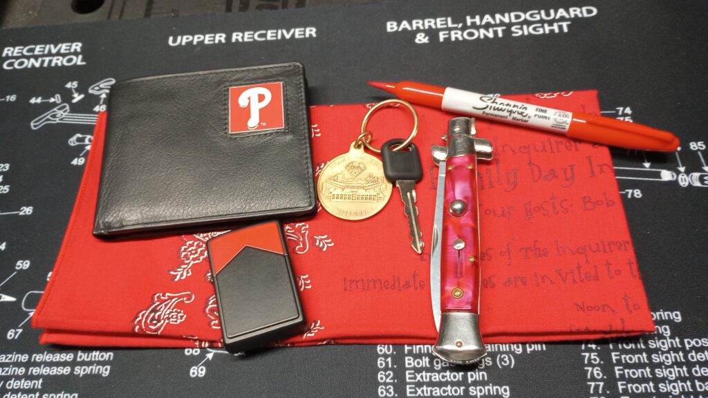 Ballpark EDC - Lite carry for the Phils game. Siskiyou Wallet Marlboro Miles Zippo ® D XIII (April 1997) CBP Keychain 1xkey (car) 1993 Gun magazine back page "Stiletto". <Stays in car> Sharpie ® Red - with full tang G10 tip. (Gets me past the metal detectors so I'm not empty handed if SHTF.)