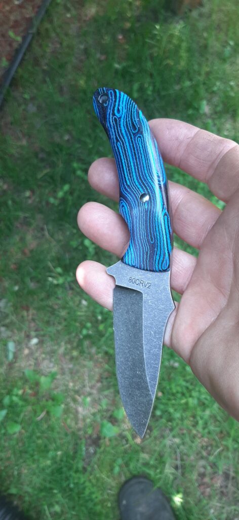 SKINNER 80CRV-2, Hollow ground - stone wash finish. In house black and blue canvas "mike"-arta scales- gun blued pin and lanyard.