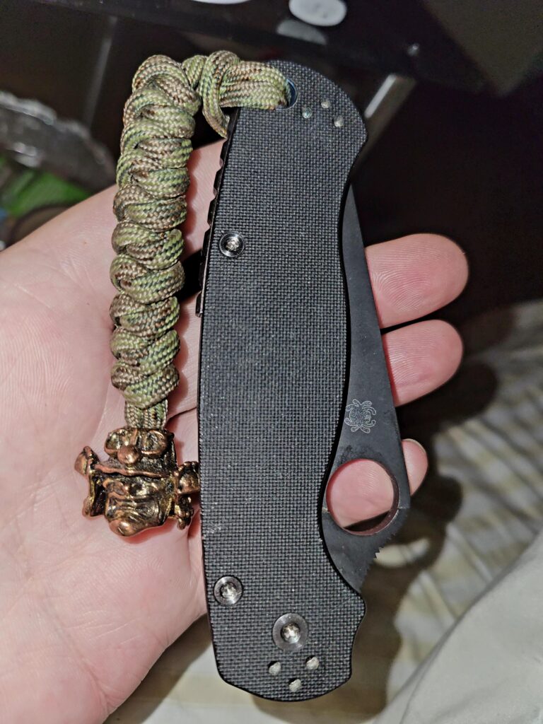 Pm2 with lanyard and bead.