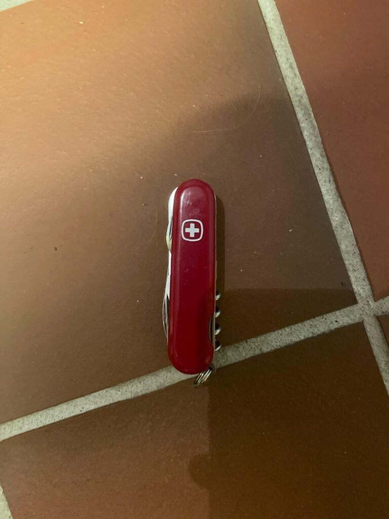 An old 90s swiss army knife that was given out to the employees of the company Roche.