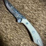 Just finished this. I call it, Viper. 1/8” Alabama Damascus steel 7 7/8” OAL 3 1/4” blade White Snakeskin Juma scales Yellow G-10 liners Nickel Silver pins