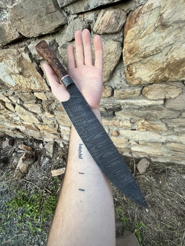 A recent commission of mine, an heirloom damascus kitchen knife. The blade is 1095/15N20 steel. Wood is wormy oak and its accented with copper pins and spacer. Thanks for looking!
