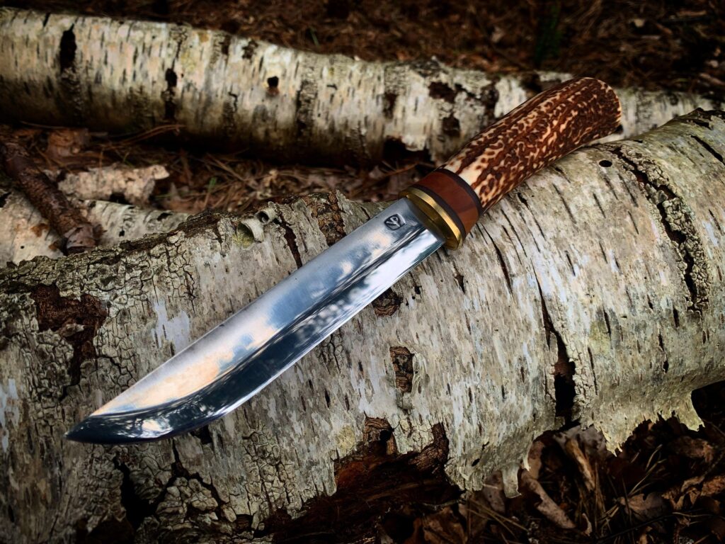 Small Leuku with antler and apple handle.