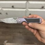 Celtic blade etch and purple ano on this Kizer Militaw