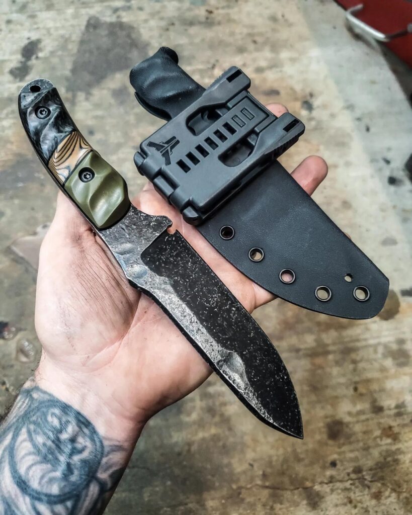 5160, with OD green G10 and Carbon Fiber handle, with black and coyote brown layered G10 split.