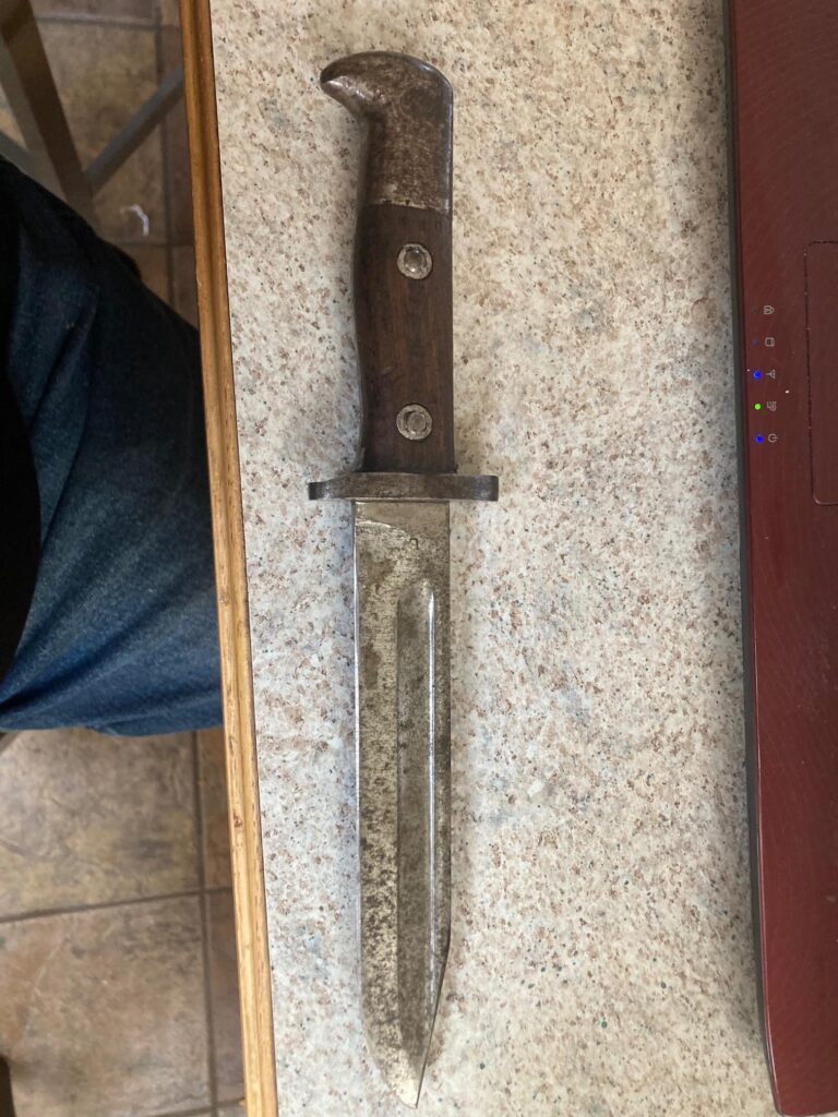 WW1 1905 Bayonet retooled into Trench Fighting Knife. Do I clean up the metal or leave it? This gal has been in the blood, the guts and the beer. You can feel it in the wood grips. I am getting a custom sheath made for it, have it resharpened, and make it part of my 'get home' camping, hiking kit.