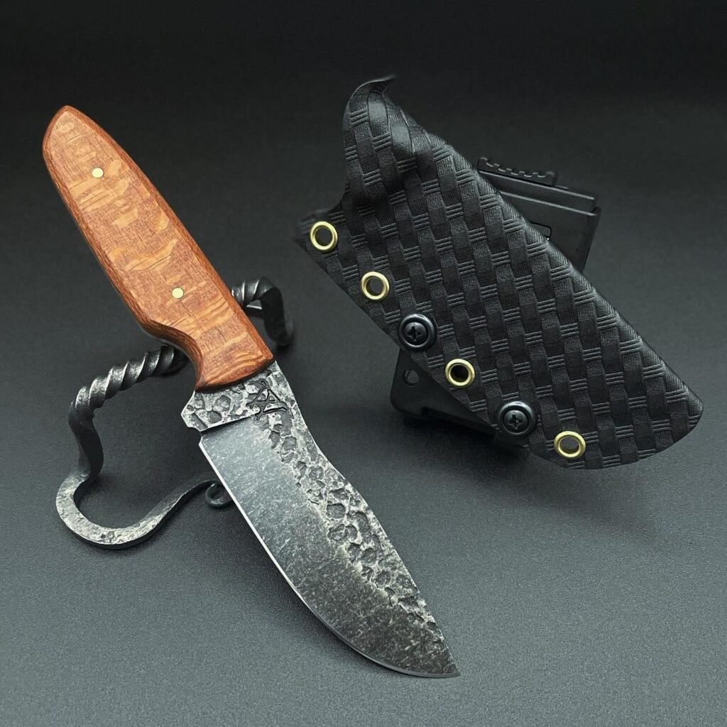 Just finished the final touches on this drop point. Handled with Leopardwood and brass to complement the pebble textured blade. What do you think?