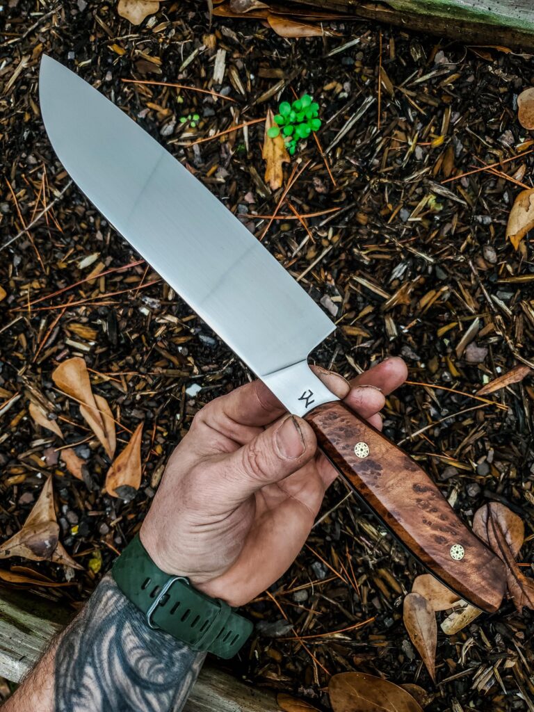 7 " Santoku in Aeb-l with Redwood Lace Burl and black G10 liners and mosaic pins.👍