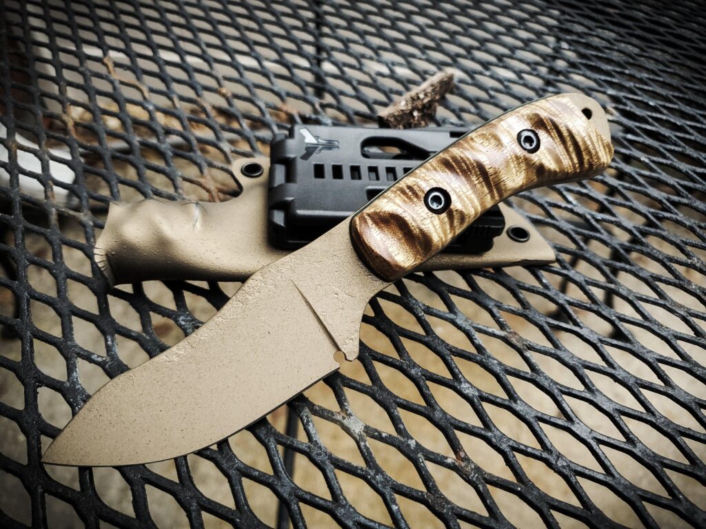 80crv2 EDC with Cerakote/ burnt bronze and sand, handles Acacia and black G10 liner.