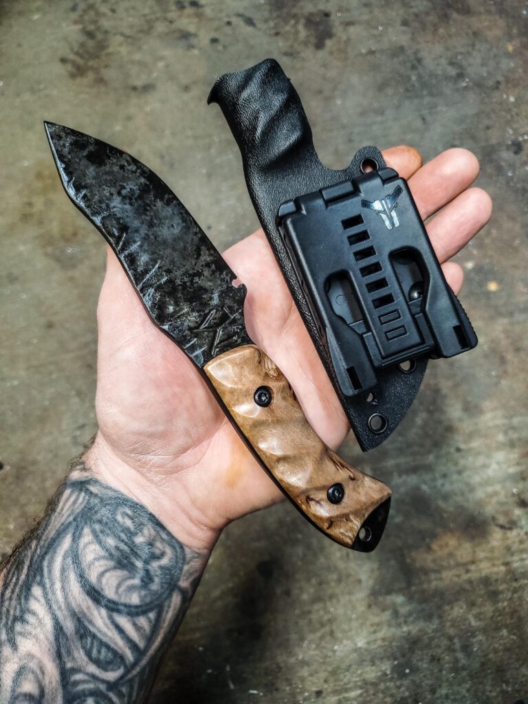 80crv2/ Granite finish with karelian Birch and black G10 liners.