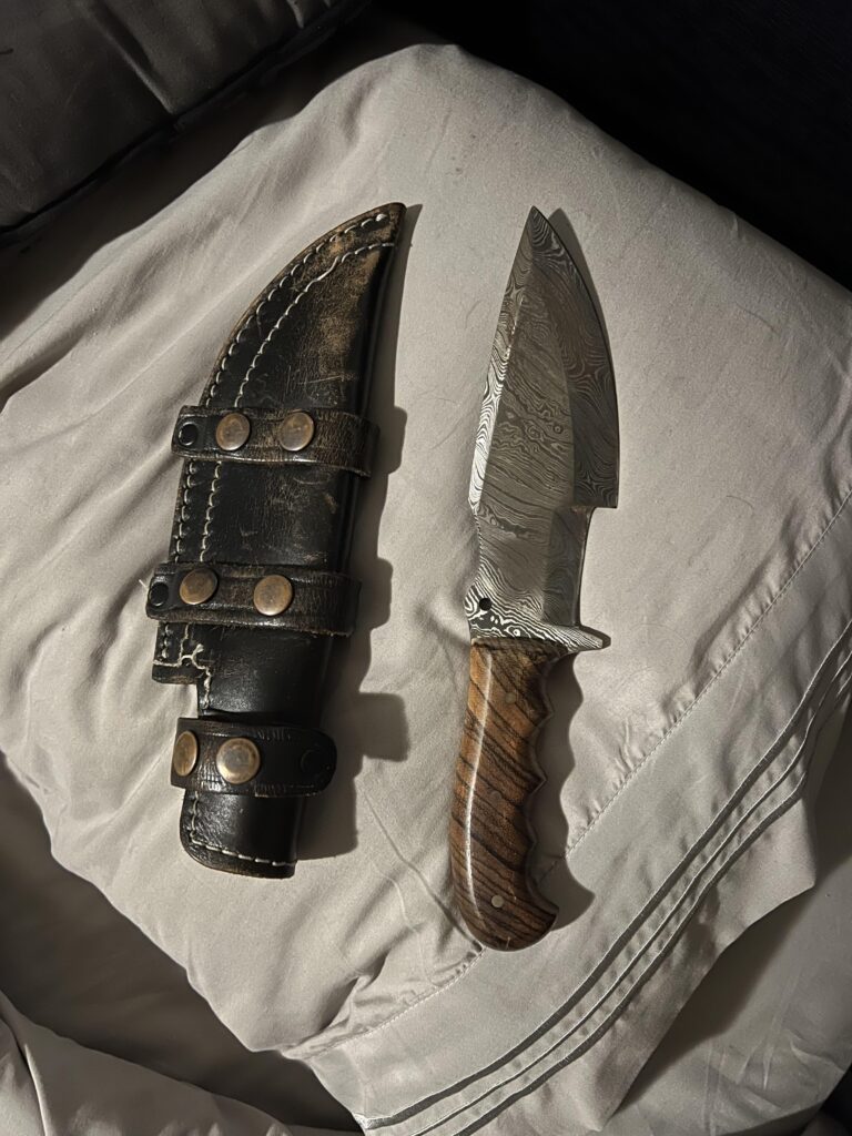 Damascus tracker with zebra wood handle
