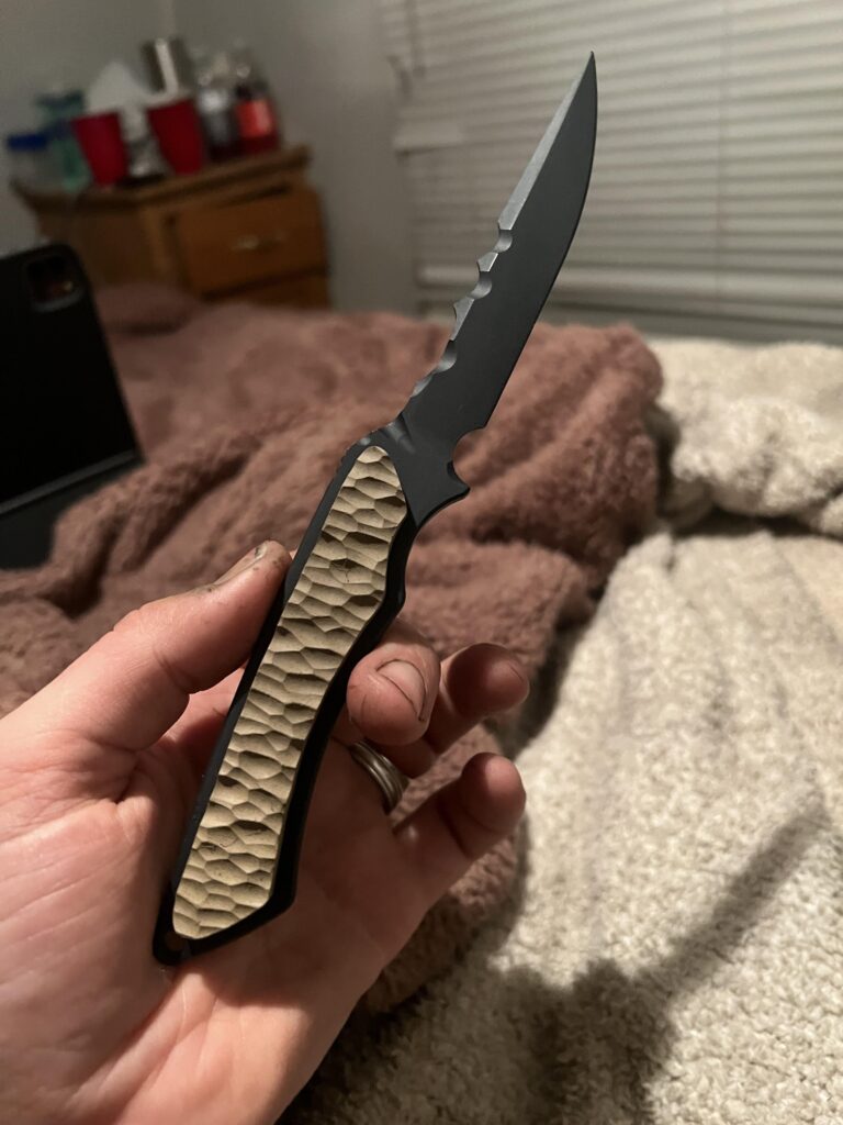 Blade I modified from another model. Completely recut the profile and bevels, Cerakoted the blade and G-10 inserts.