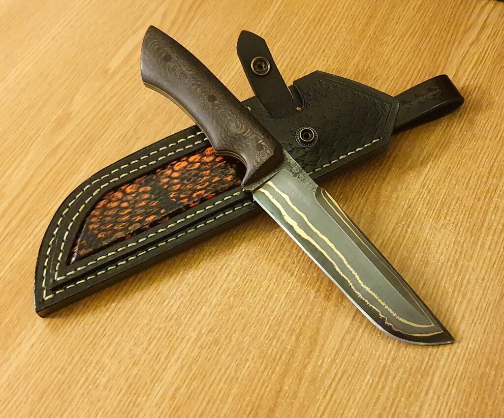 Finally done. Bronze Mai Damascus with 52100 core and stabilized wood. What do you think?