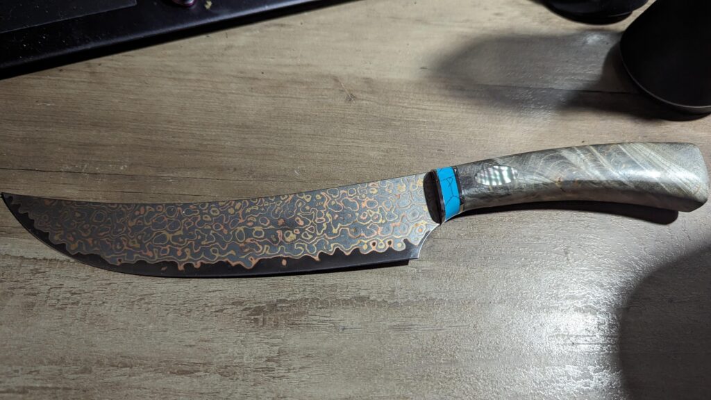 Qsp noble series butcher knife. Copper and brass Damascus, with turquoise and stabilized wood. The new work knife.