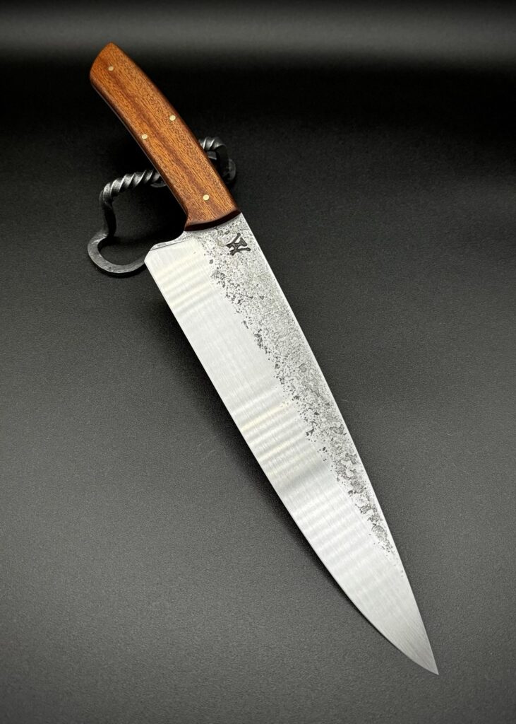 Hammer Forged 80crv2 Brut Chef 🔥 hand sanded to 320grit. Brass & Sapele hardwood handle pressure soaked in danish oil and hand sanded to 3,000grit.