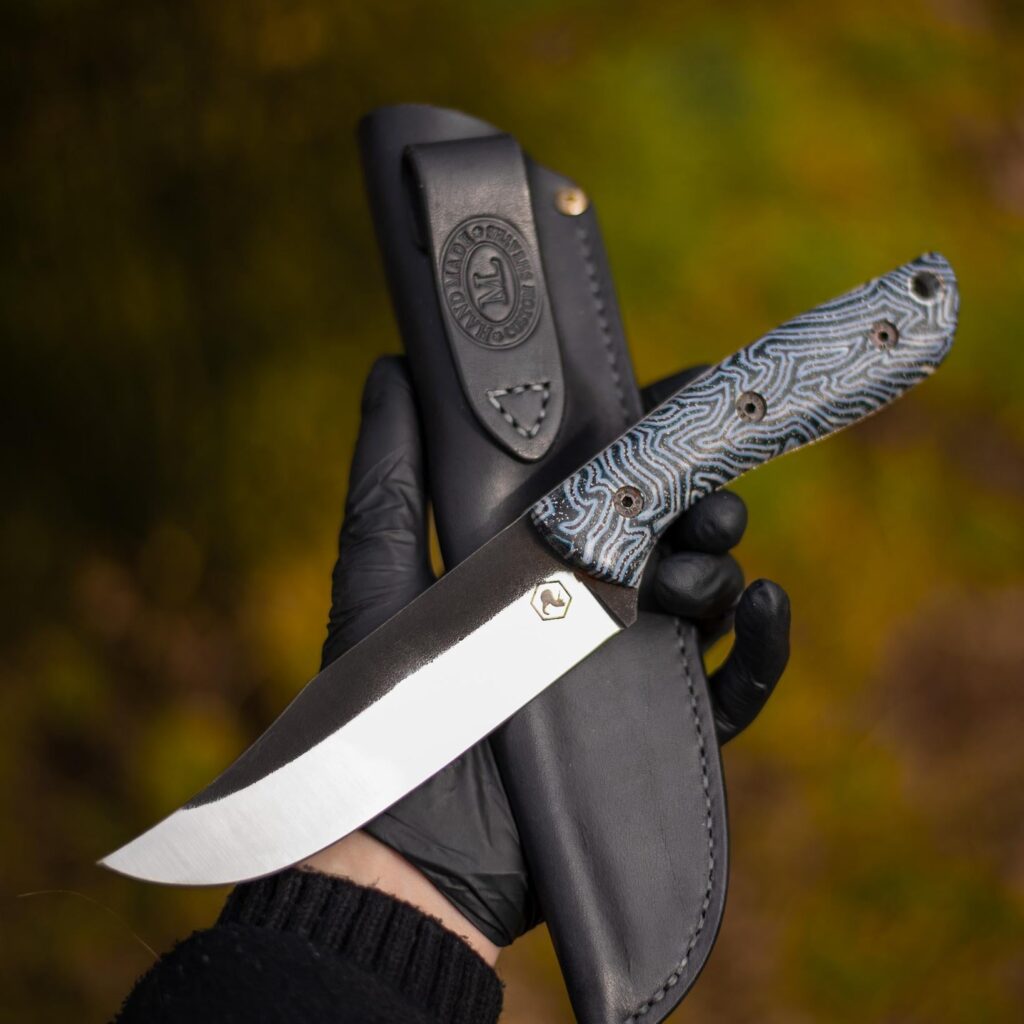 Bowie made by me of  N690 steel with damascus micarta handle and leather sheat