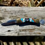 (Knife ID) I got this as a gift but know nothing of its origin. Anyone know what company or artist made this beautiful inlay?