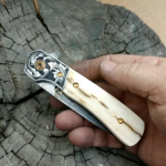 Almost done with this folder. Hand engraved bolsters with mammoth ivory scales. Engine jeweled Titanium liners with 24k gold plated screws