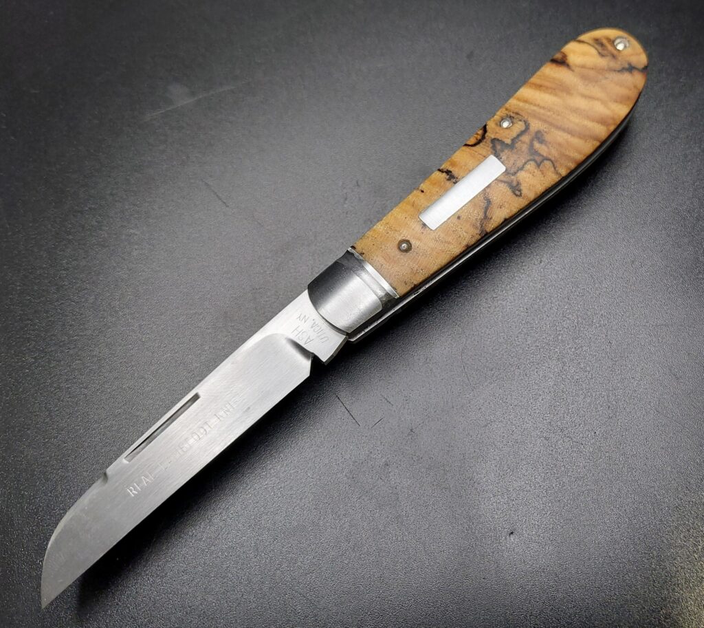 Instagram: @ash.handmade.knives  A2 Carbon steel Lambfoot wrapped in Hackberry.  Handmade custom slipjoint.  Photo from Samsung A23 cell phone