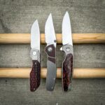 The poor frightened micarta found herself surrounded by a dragon and some burly guy in the woods.