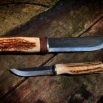 Two homemade knives. Both made with Lauri blades, deer antler and birch bark.