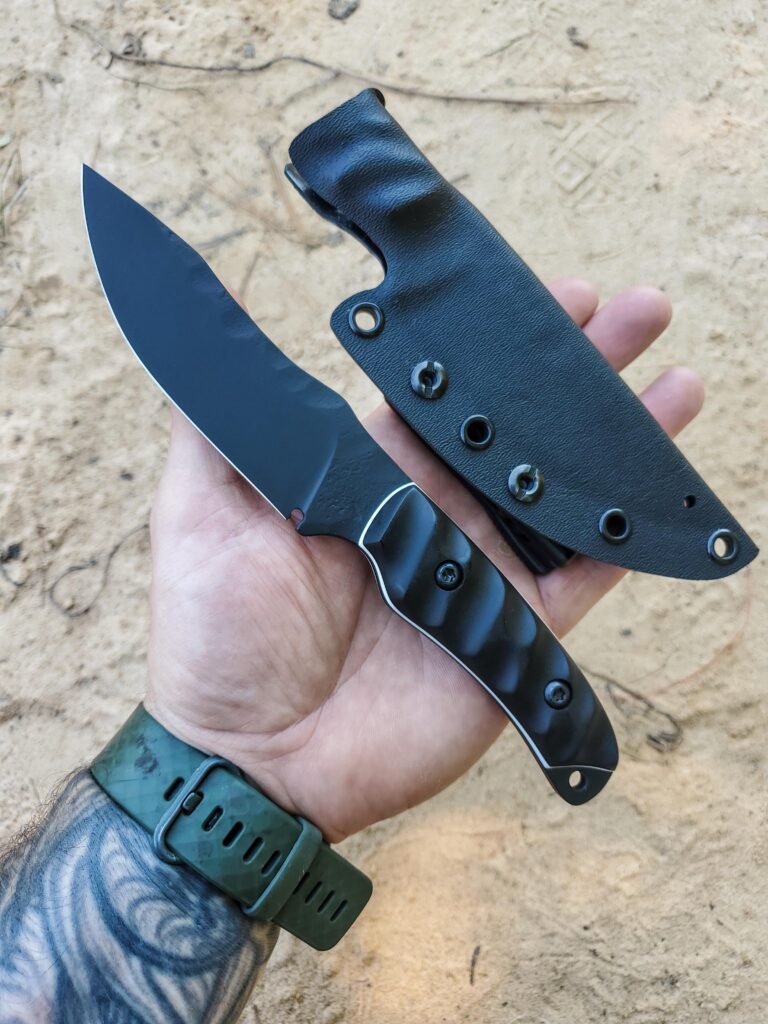 80crv2 Armor Black cerakote G10 handle and liners.