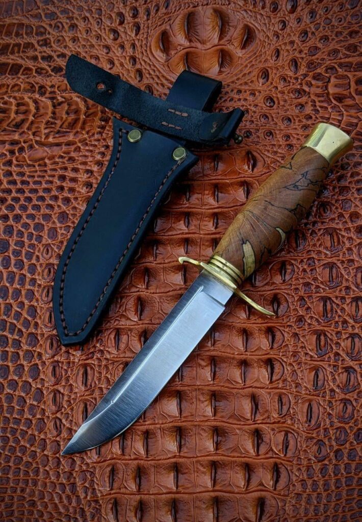 Made this knife as my first commission on etsy! Steel is H12MF 60 hrc, beech burl and bronze. Stick tang, threaded on the end, no welds. Fully dissassemble. What do you think of if?