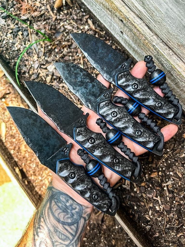 80crv2 with Royal blue G10 liners and carbon fiber handles, matching lanyard beads.