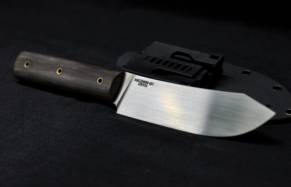 1 of 3 Nessmuk styled blades I'm currently working on. Soviet micarta, 14C28N with cryo. 11.15" OAL, 5.85" blade length. What do you think?