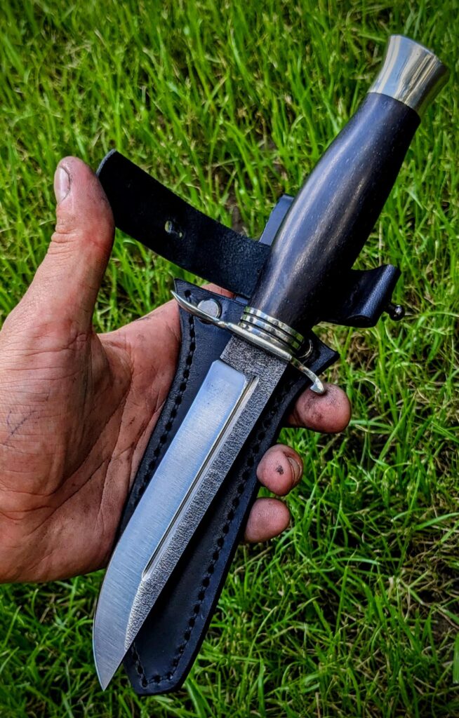 My latest Black&Silver knife that was made for a commission. I really like the colors on this one. What do you think of this design and what should I add?