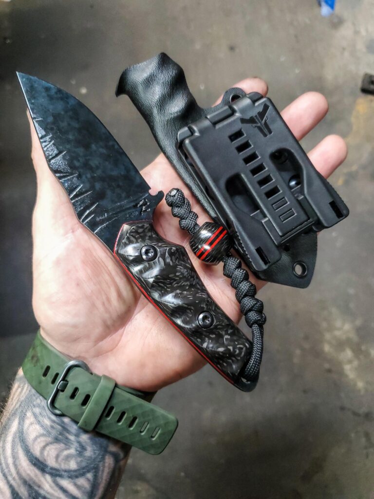 80crv2 EDC stonewashed and cold blued, with Carbon fiber and Ruby Red G10 liners, matching bead with Paracord lanyard.👍