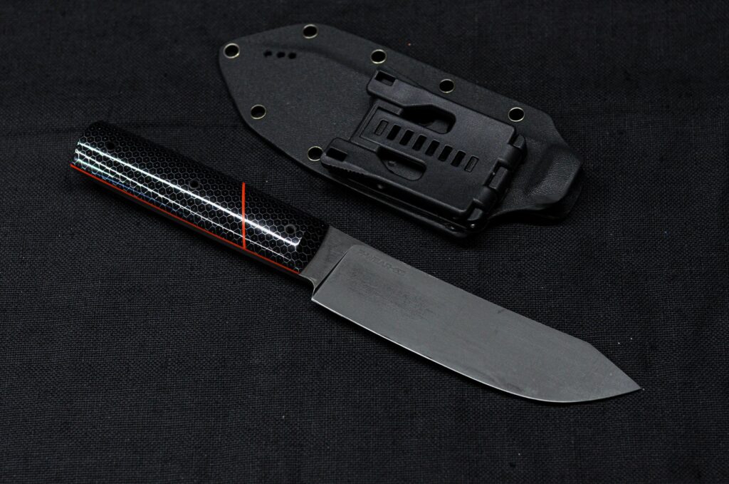 Something like an outdoor butchers knife, Z-Wear @ 63HRC and some C-Tek!