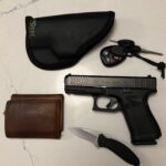 5th Glock 19, sticky holster, 2006 Silverado and FCS fin key, timberland wallet, and Kershaw scallion pocket knife