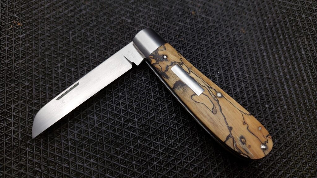 handmade custom slipjoint in spalted tamarind 14c28n stainless (Samsung A23 cell phone pic)