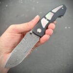 Steelhead with Twist Damascus blade and black lip MOP inlay. Tuch Knives