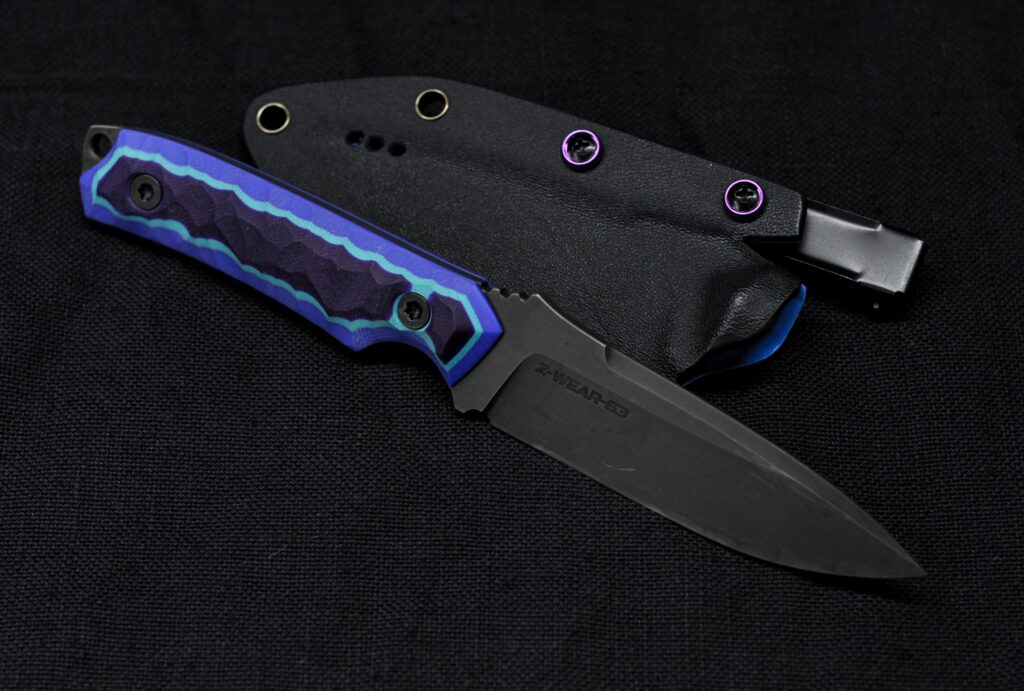 A friend wanted a knife made inspired by the Benchmade Nimravus, but with my twist on it, so there it is. Z-Wear and some G10 l mashed up together