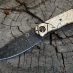 Finished this today. ADS damascus with some cross cut mammoth. I added Timascus collars and Ti screws just for looks