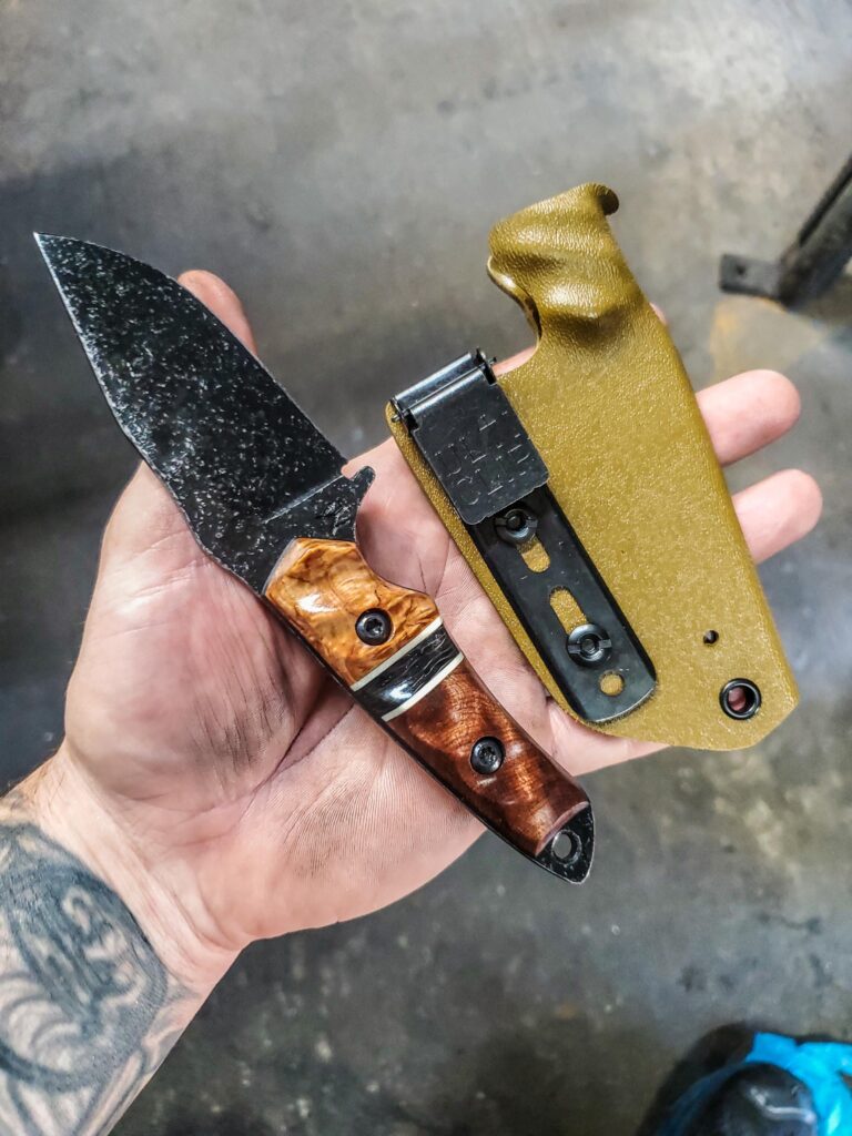 80crv2 stonewashed with Karelian Birch and old growth Red wood and an carbon fiber split.